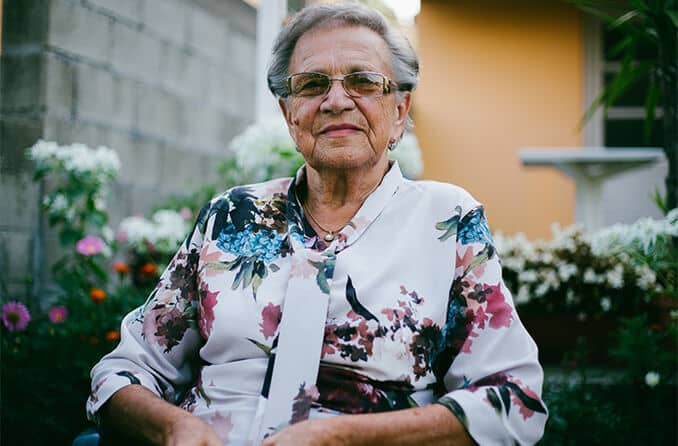 Senior woman outdoors wearing glasses